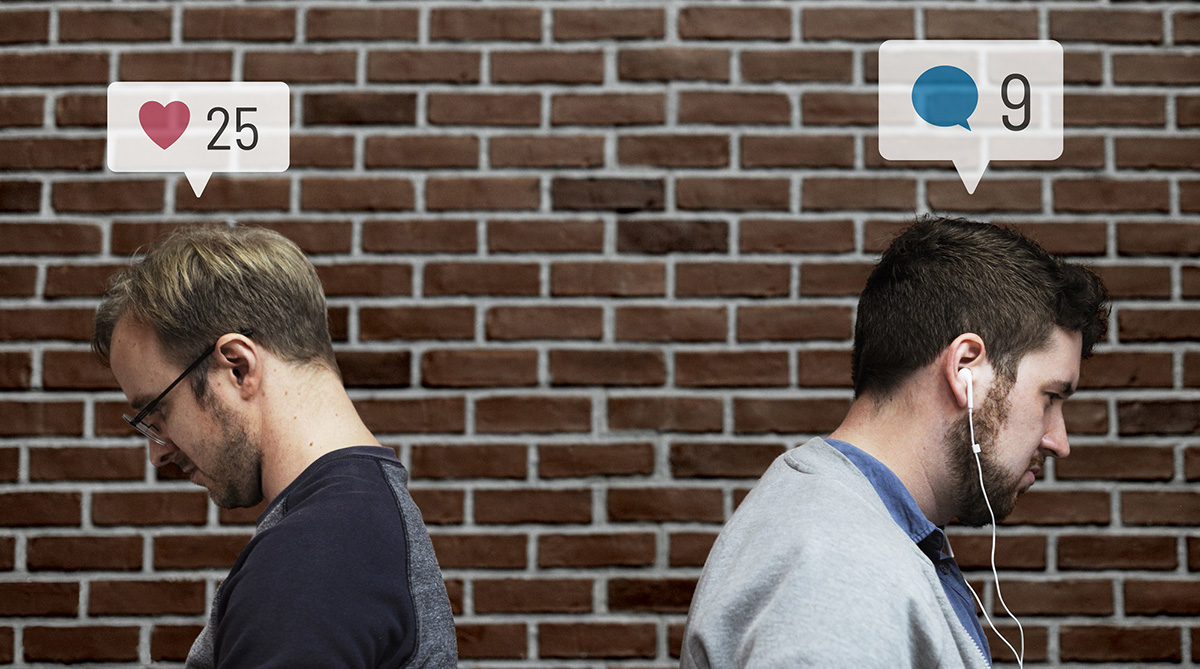 Social media and mental health impact shown by two men standing back to back, disconnected